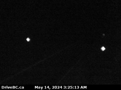 Hwy-3, at the Bombi Summit, approximately 22 km south-east of Castlegar, looking west. (elevation: 1215 metres) Traffic Camera